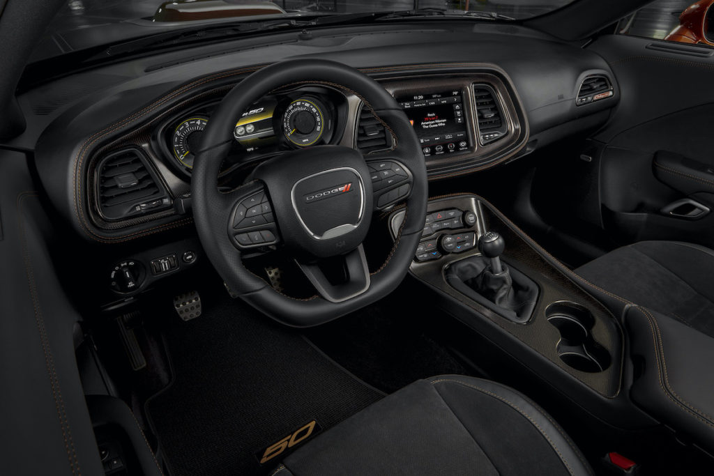 From the steering wheel to the instrument panel, startup screens, gauge faces, seat backs, door bolsters and floor mats, the 50th Anniversary theme extends into the Challenger’s athletic interior.