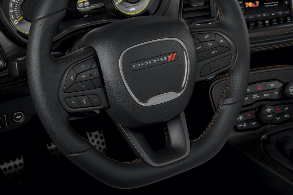 The Sepia accent stitch appears throughout the interior and on the suede, flat-bottom steering wheel.